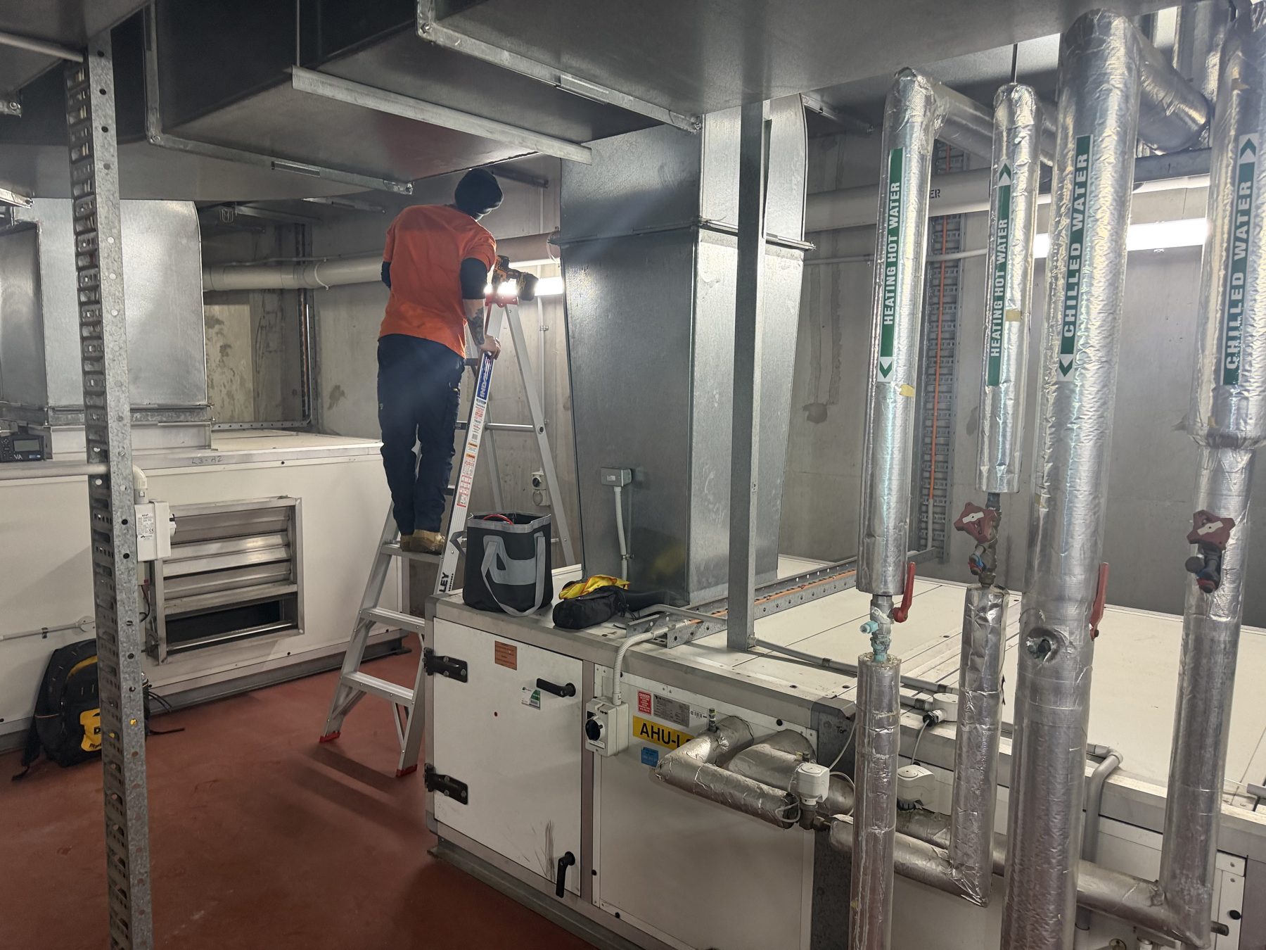 Heating hot water and chilled water services in a plant room