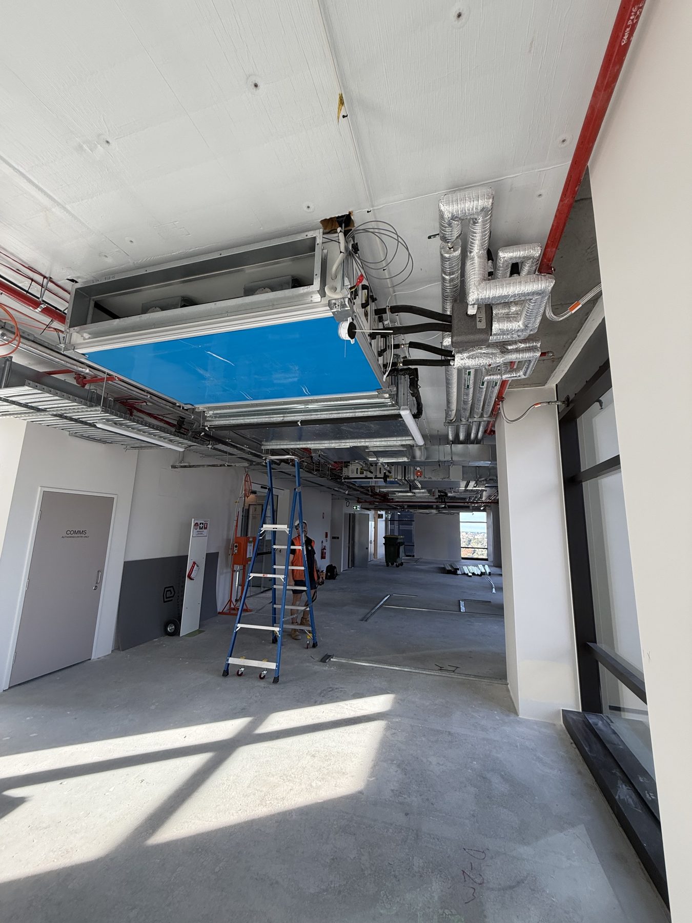 Fan coil unit and insulated ductwork in a new fitout