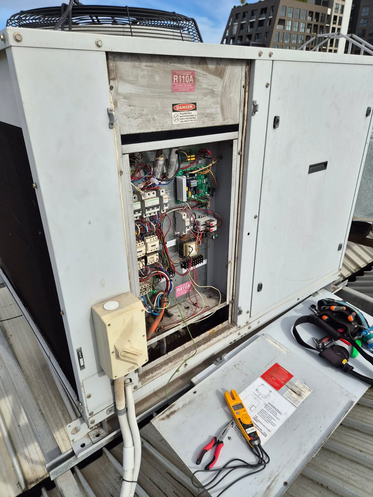 Electrical fault-finding inside the control panel of a packaged rooftop unit