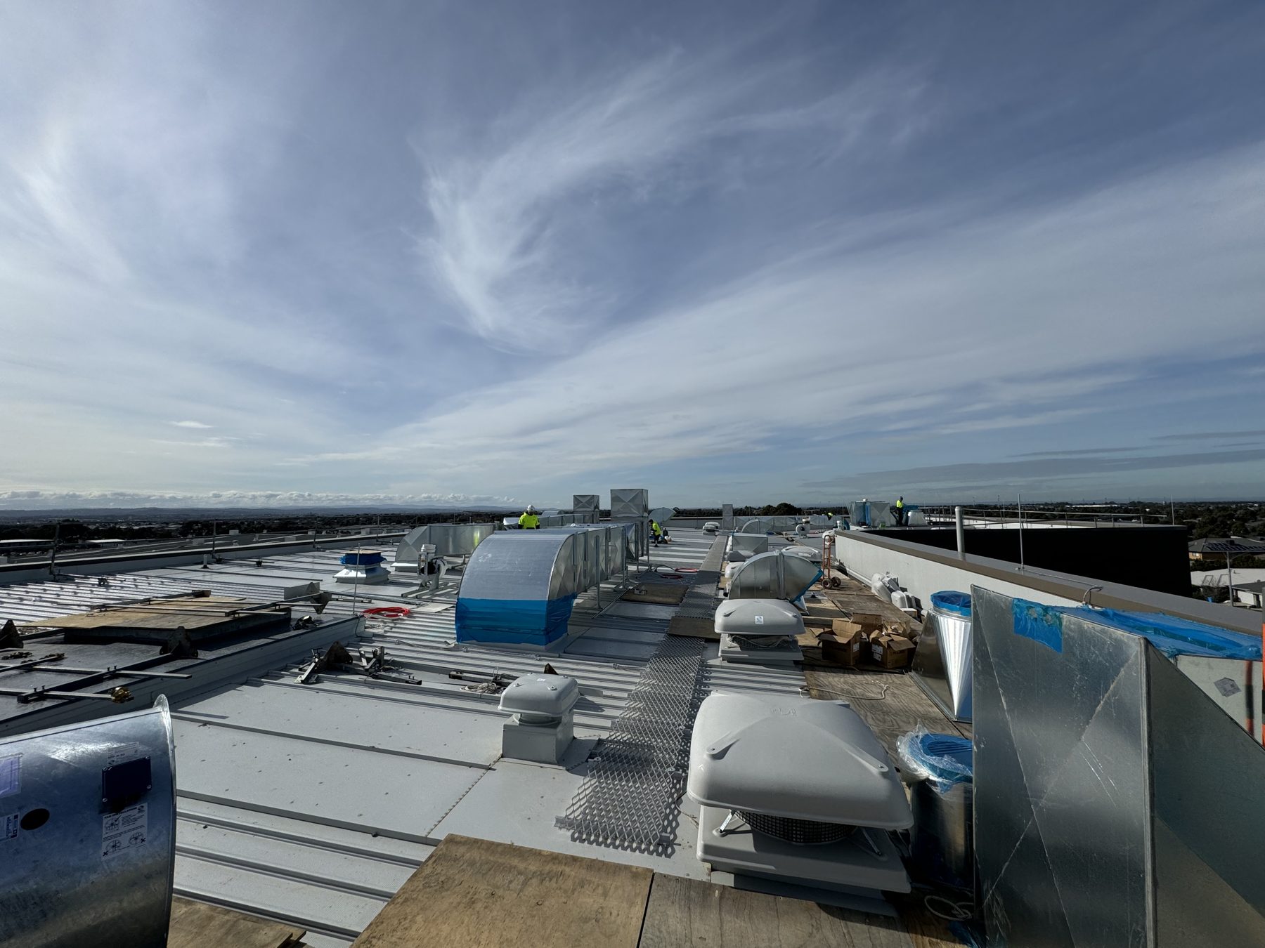 Rooftop mechanical plant and ventilation cowls being installed